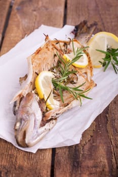 freshly baked fish on sandwich paper