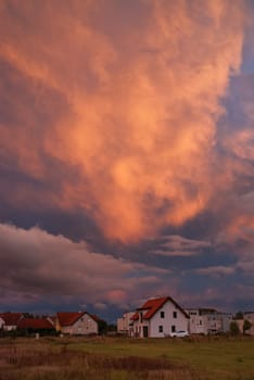 Red cloud over a house