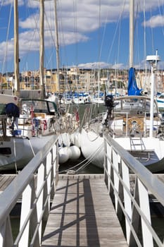 Wide angle view of a jetty with sailing yachts in the port of Gruissan in the south of France