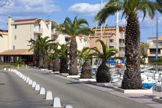 The harbour with promenade and holiday apartments of Gruissan in the south of France