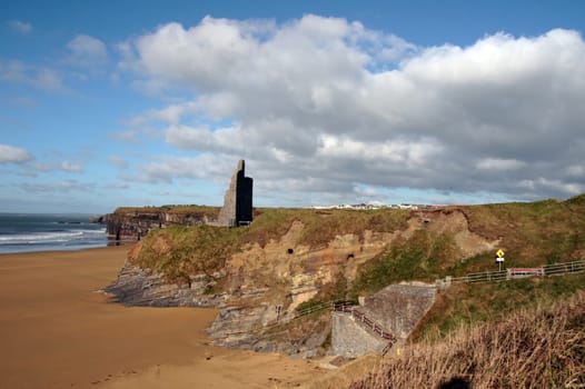 ballybunion castle on the cliffs in the west coast of ireland above a beautiful beach