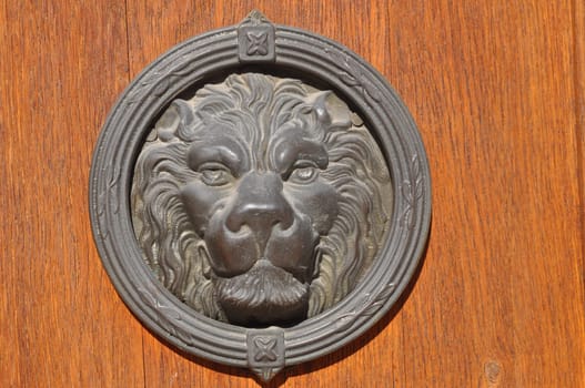 Detail of an ancient Venetian mask in the city of Venice (Venezia) in Italy