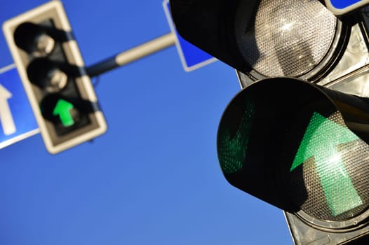 Traffic lights over a blue sky
