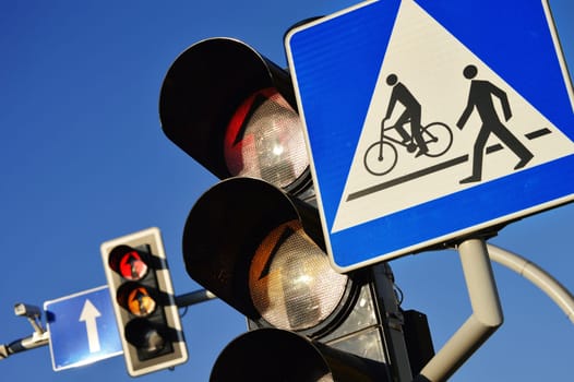 Traffic lights over a blue sky