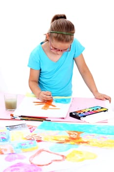 Schoolgirl painting with water coloron white background