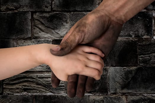black dirty man hands holding kid clean hand concept