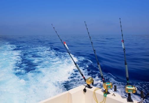 boat fishing trolling in deep blue ocean offshore in Mediterranean sea
