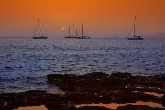 colorful sunset of Ibiza view from formentera with Es Vedra