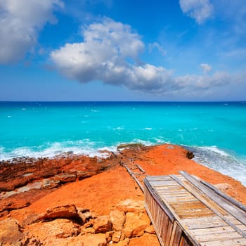 Cala Saona rocky coast with aqua turquoise rough Mediterranean sea