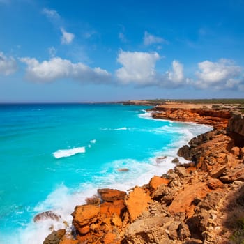 Cala Saona rocky coast with aqua turquoise rough Mediterranean sea