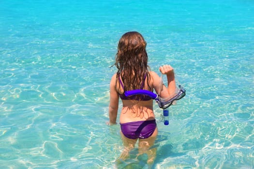 aqua beach in ibiza formentera rear kid girl view with snorkel