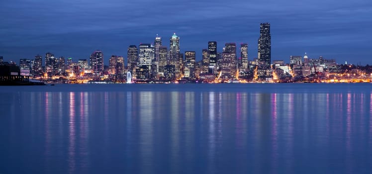Seattle from the West Side as night falls with a storm moving in