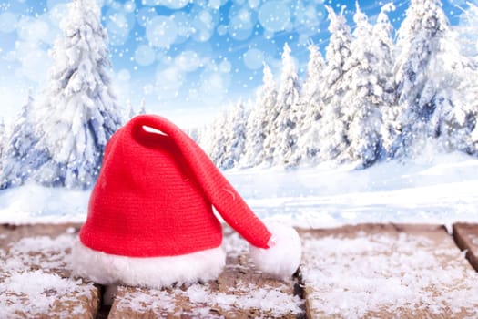 Winter forest and Christmas hat