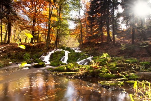 Waterfall in autumn light