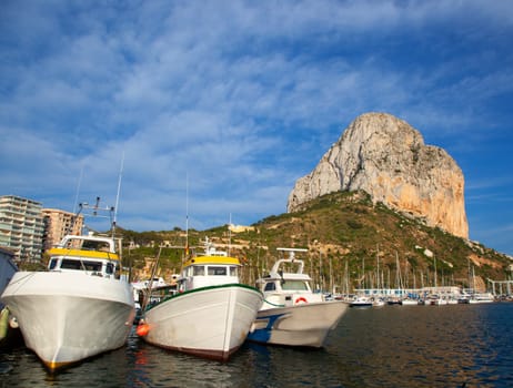 Calpe in alicante with Penon Ifach mountain and marina boats