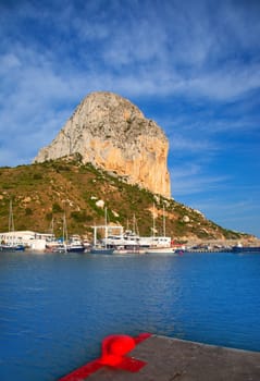 Calpe in alicante with Penon Ifach mountain and marina boats