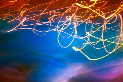 Abstract motion blurred lights on blue background