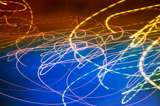 Abstract motion blurred lights on blue background