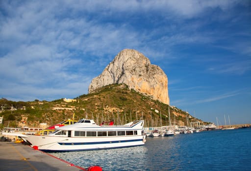 Calpe in alicante with Penon Ifach mountain and marina boats