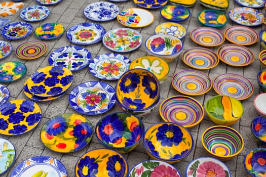 ceramics from Mediterranean Spain in street market display on floor