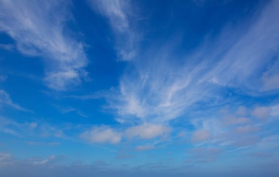 Blue sky with clouds blue background