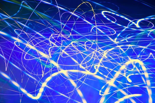 Abstract motion blurred lights on blue background