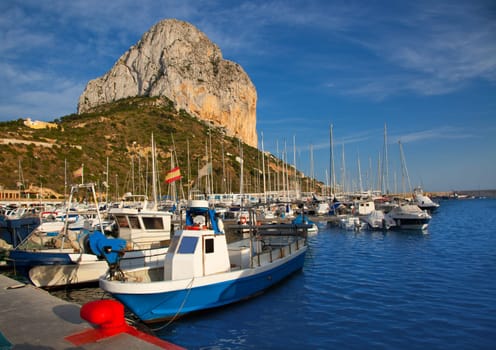 Calpe in alicante with Penon Ifach mountain and marina boats