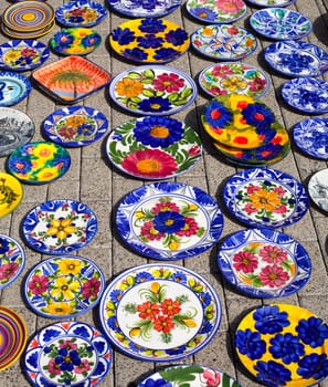 ceramics from Mediterranean Spain in street market display on floor