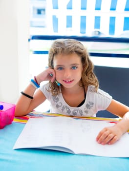 children kid girl smiling with homework in summer holding pencil