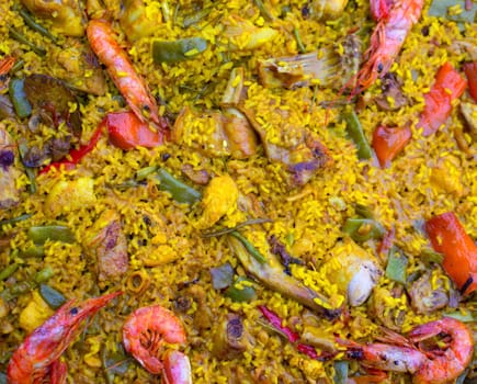 Spanish rice paella mixed of meat and seafood in Valencian community