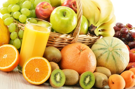 Composition with assorted fruits in wicker basket isolated on white