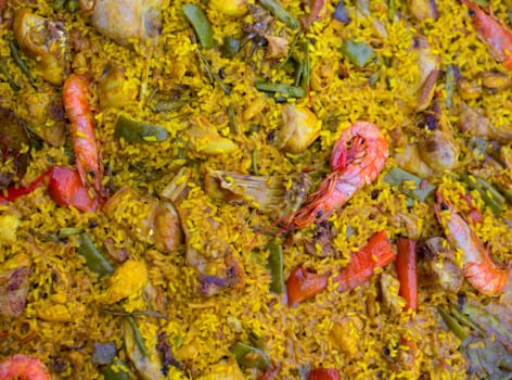 Spanish rice paella mixed of meat and seafood in Valencian community