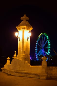 City of valencia night bridge Puente del Mar streetlights and ferry wheel