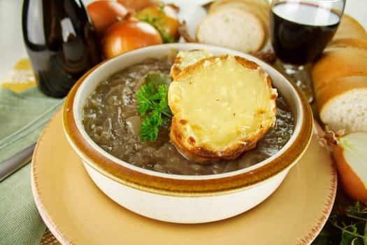 French onion soup with cheese and cheddar rounds ready to serve.