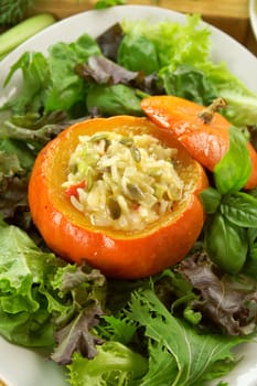 Baked golden nugget pumpkin with rice stuffing ready to serve.