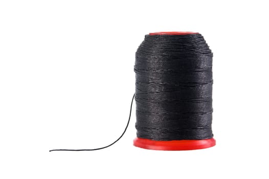 A bobbin of black thread close up isolated on white background.  Included clipping path, so you can easily cut it out and place over the top of a design.