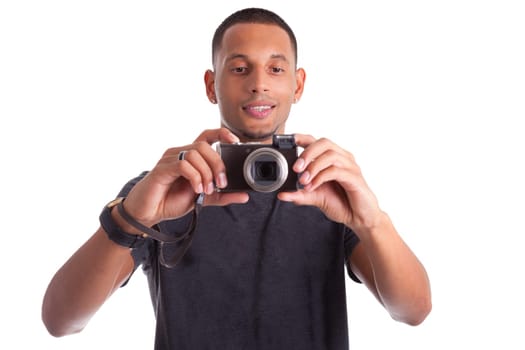 Portrait of a young african american man holding and taking a picture, isolated on white background