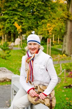 Portrait of a mature woman in the autumn  park