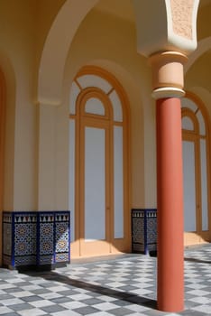 Architectural detail of an ancient building. Column and archs