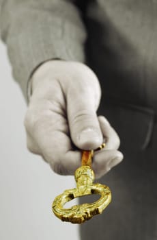 Businessman handing and giving a key to success