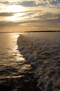 Cloudy dramatic dawn seascape at Montevideo city bay, Uruguay. Vertical picture from the water with nobody.