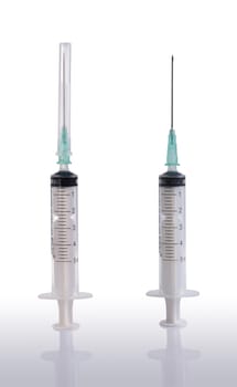 Two syringes and needle with its reflection on clear background.  Included clipping path in every object, so you can easily cut it out and place over the top of a design