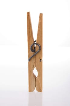 Clothes peg isolated with its reflection on white background.  Included clipping path, so you can easily cut it out and place over the top of a design.