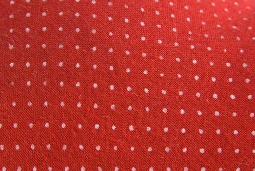 Retro red cloth with white dots as background.