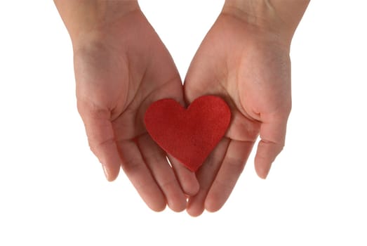 Two woman hands holding a fabric red heart isolated on white background.  Included clipping path, so you can easily cut it out and place over the top of a design.