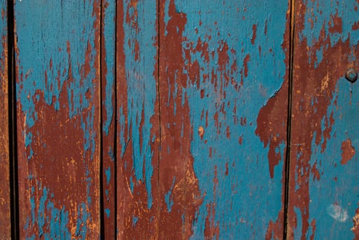 Vintage wooden texture with grunge paint close up. Useful as background for design works.
