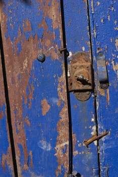 Vintage wooden blue door close up. Useful as background for design works.