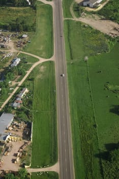 Aerial view of road in green fields in Uruguay.