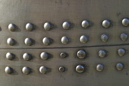 Silvel metal texture with rivets and screws. Useful as background for design works.