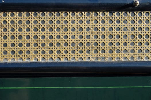 Rattan texture on the back of an old chariot. Retro background